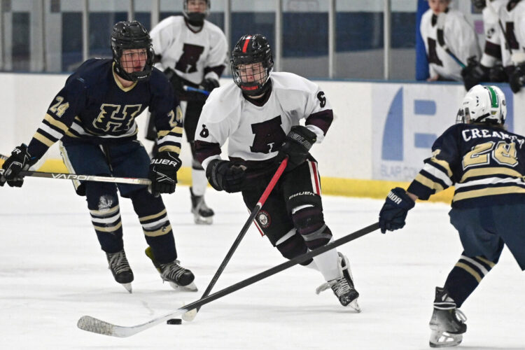 Hartman outduels Crum to lead Tigers over Lions